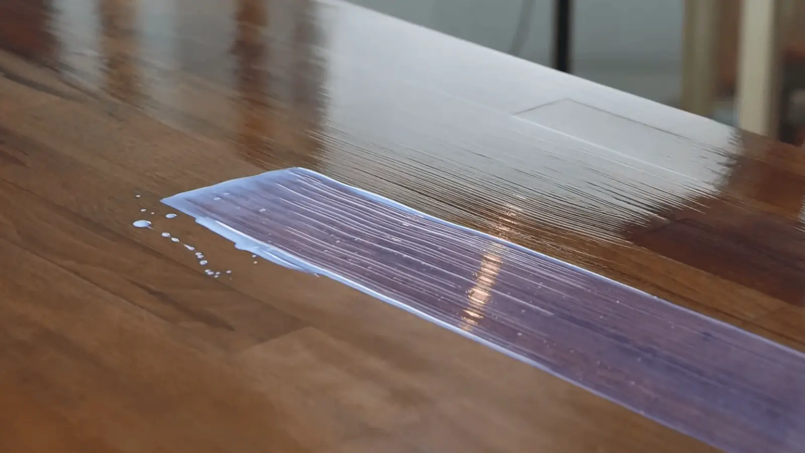 Applying water-based polyurethane with brush on table surface