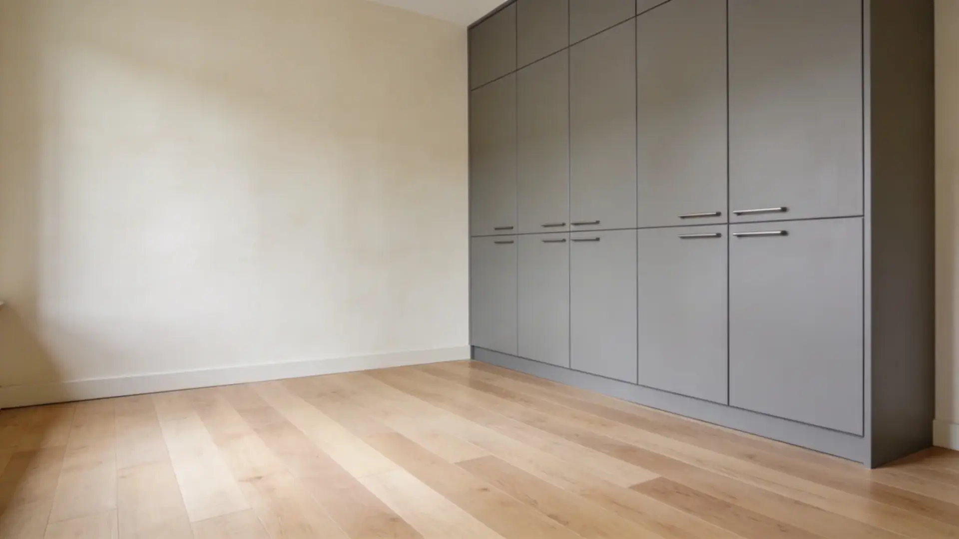 Finished room with installed flooring, painted walls, and built-in cabinets