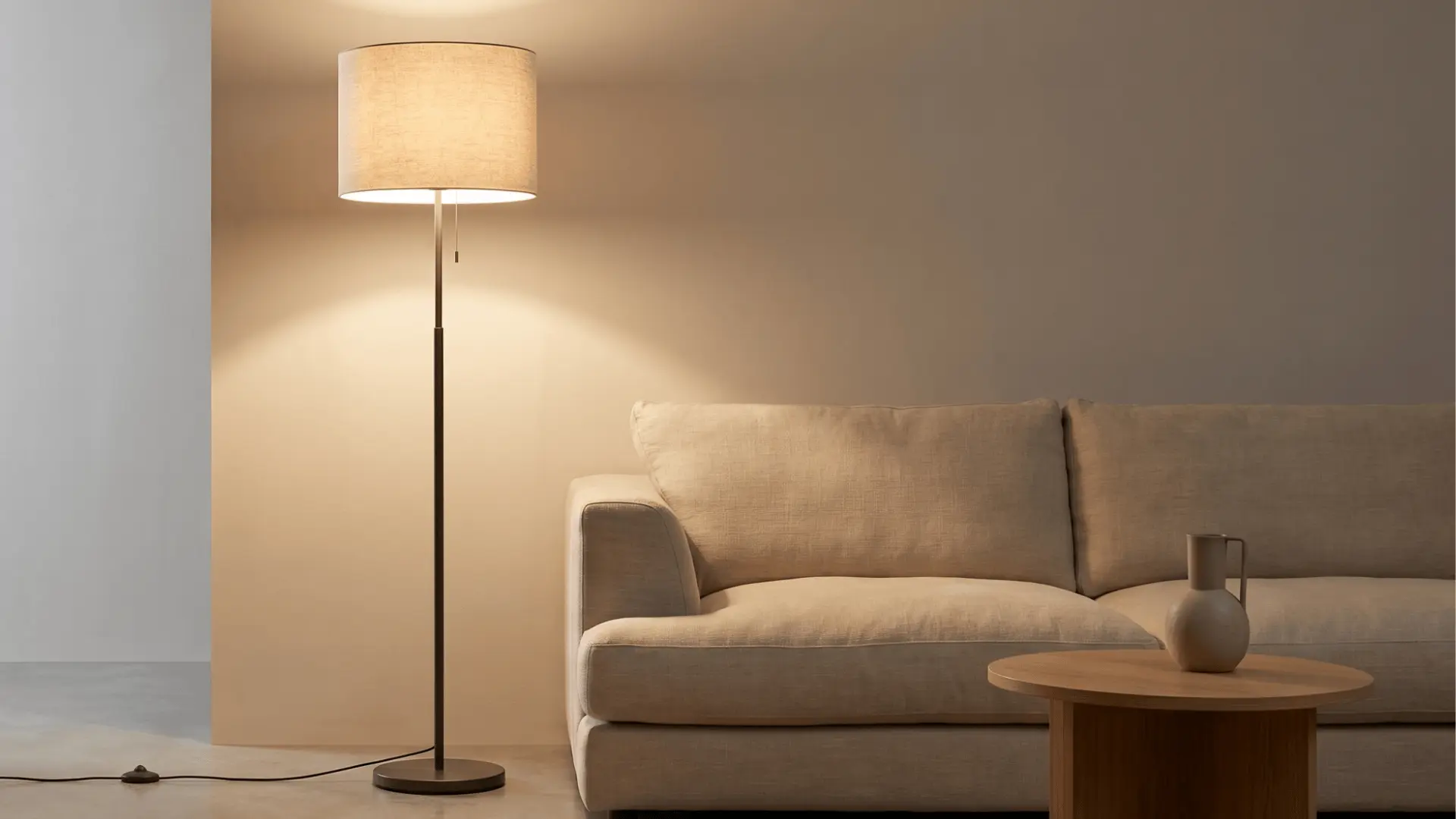 Floor lamp casting soft light in a minimal living room