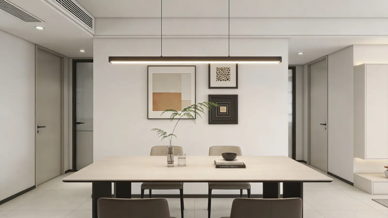 Linear light fixture above a long rectangular dining table