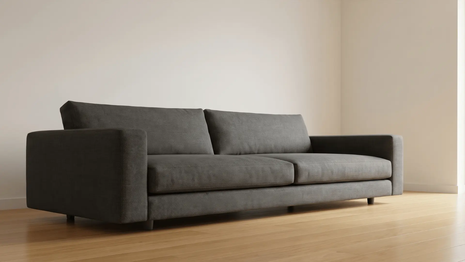 Low sofa with short legs and cushions close to the floor in a living room