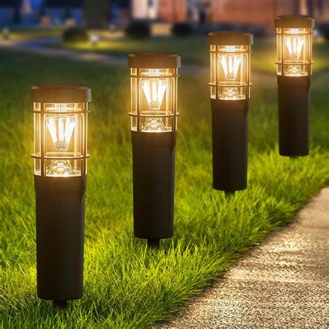 Outdoor solar lights lining a front path at night