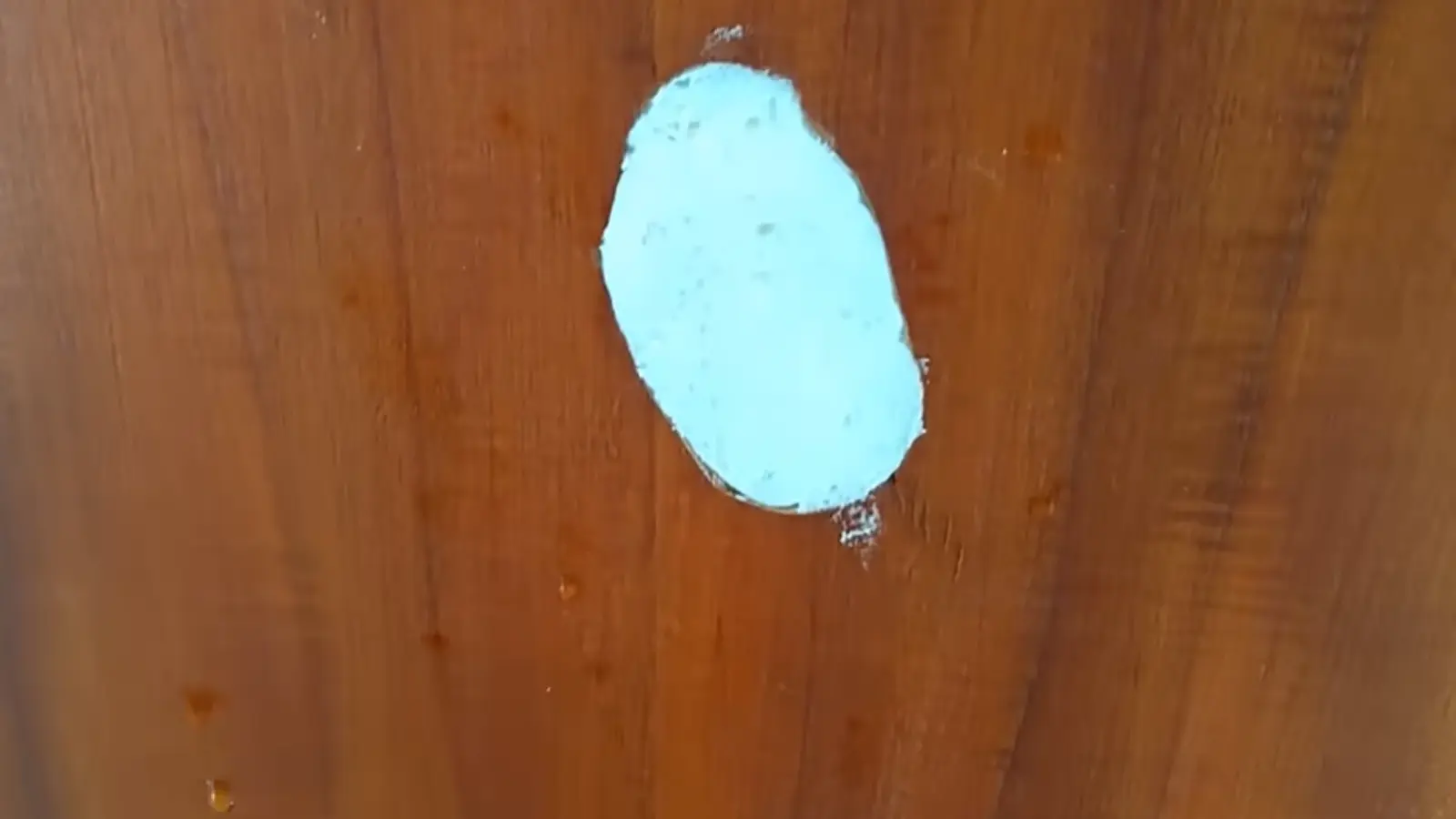 Sanded foam surface being smoothed flush with the door