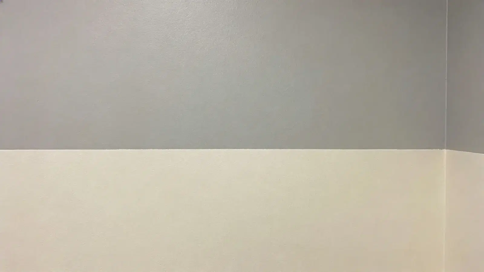 Wall painted halfway with two contrasting colors