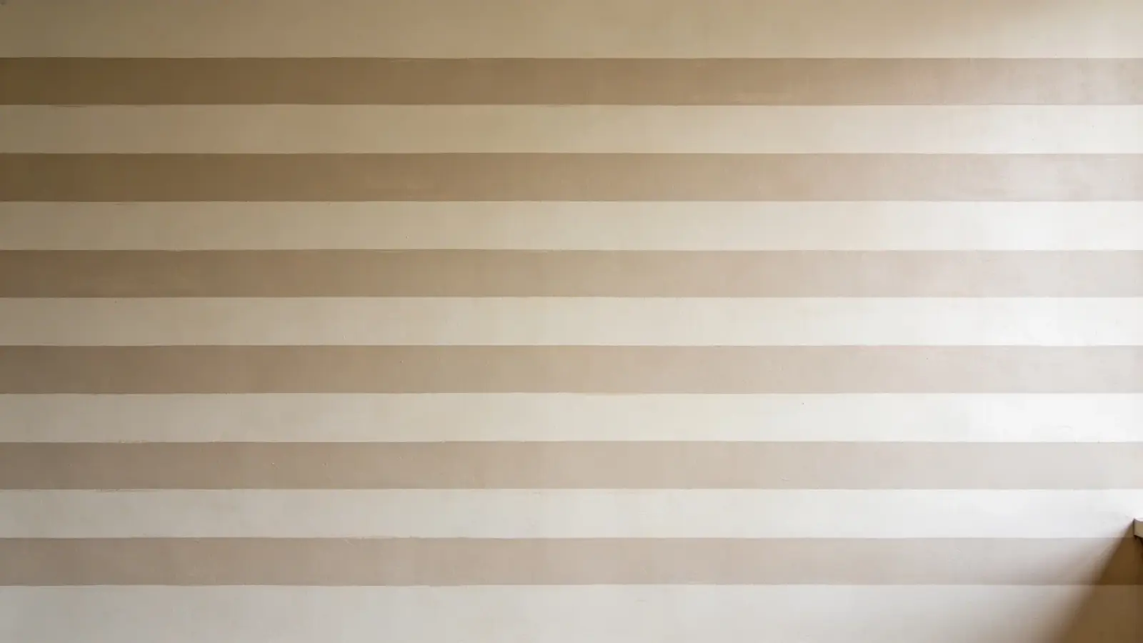 Wall with horizontal painted stripes across the surface