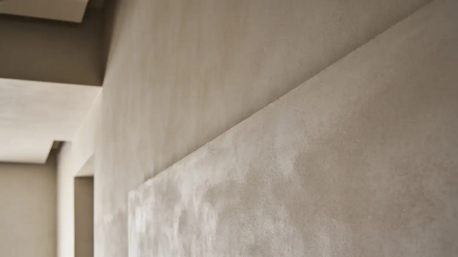Wall with smooth plaster finish showing subtle tonal variation