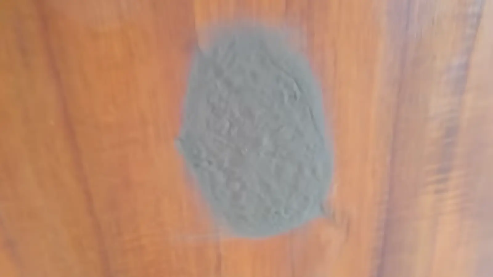 Wood filler applied over repaired area to smooth the surface