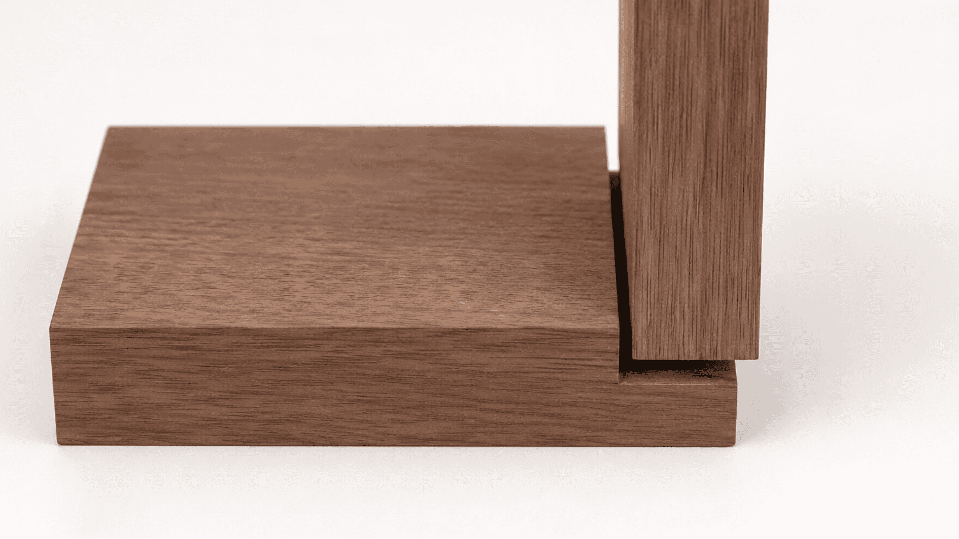 Realistic rabbet joint with oak wood pieces showing a recessed edge connection on a wooden surface.