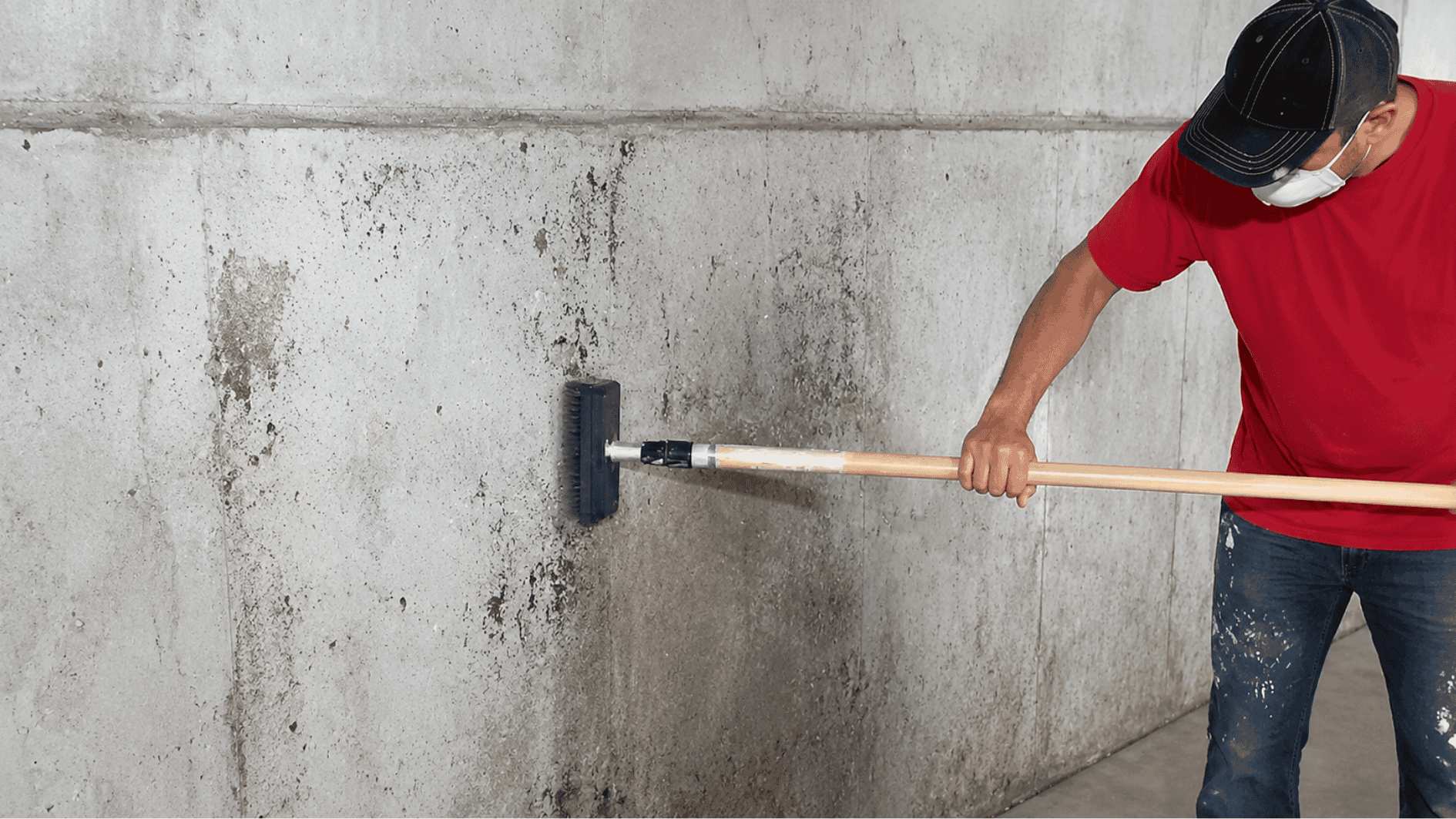 cleaning a gritty concrete wall