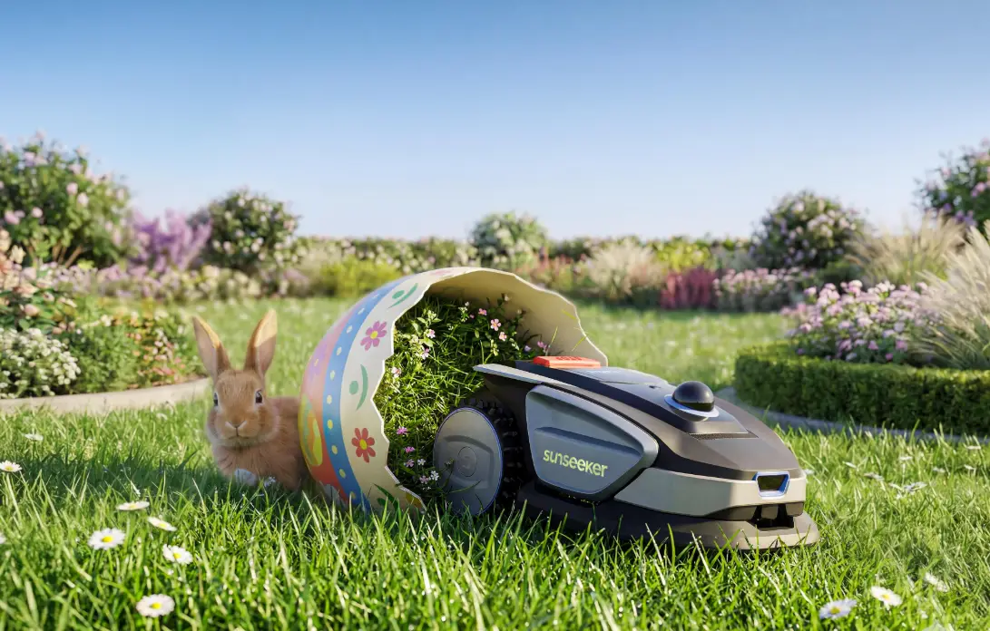 Robotic lawn mower beside rabbit and broken Easter egg in sunny garden setting