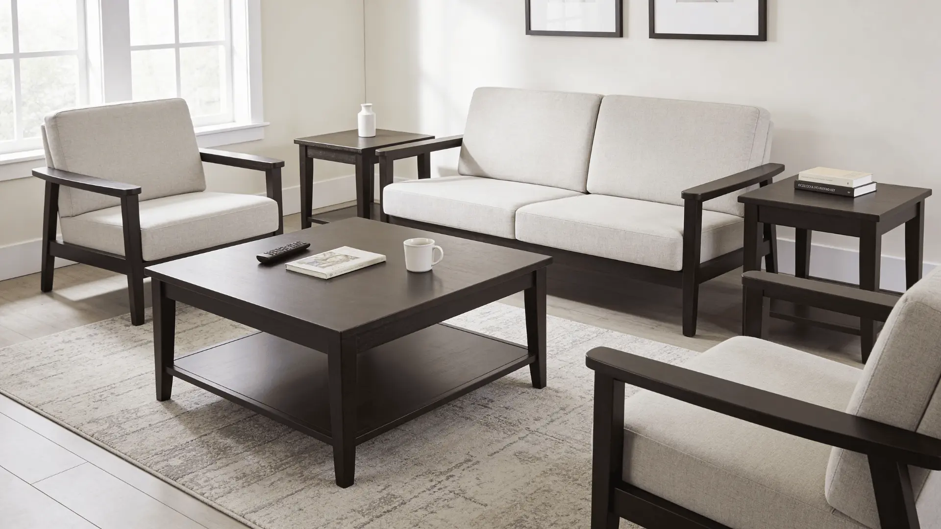 Living room with coffee table and side tables placed around a sofa seating area