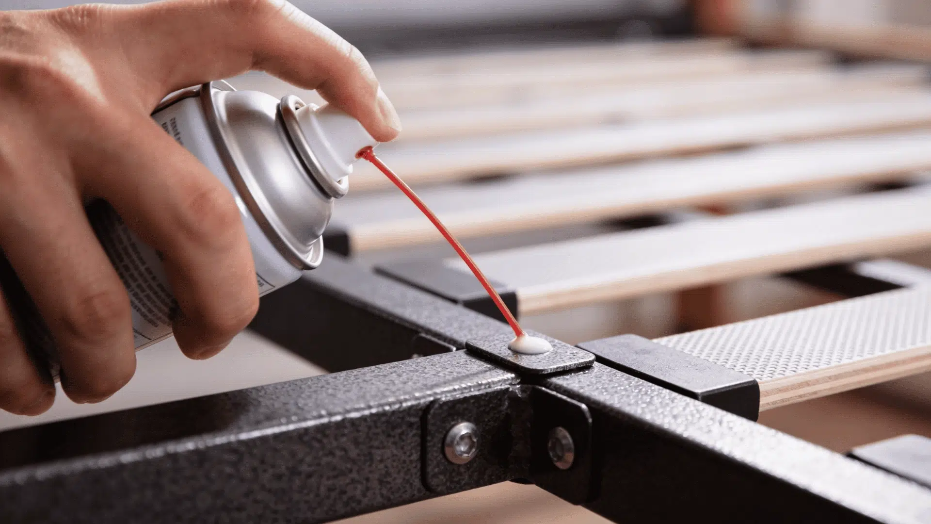 Lubricant can applying product to a metal bed frame joint