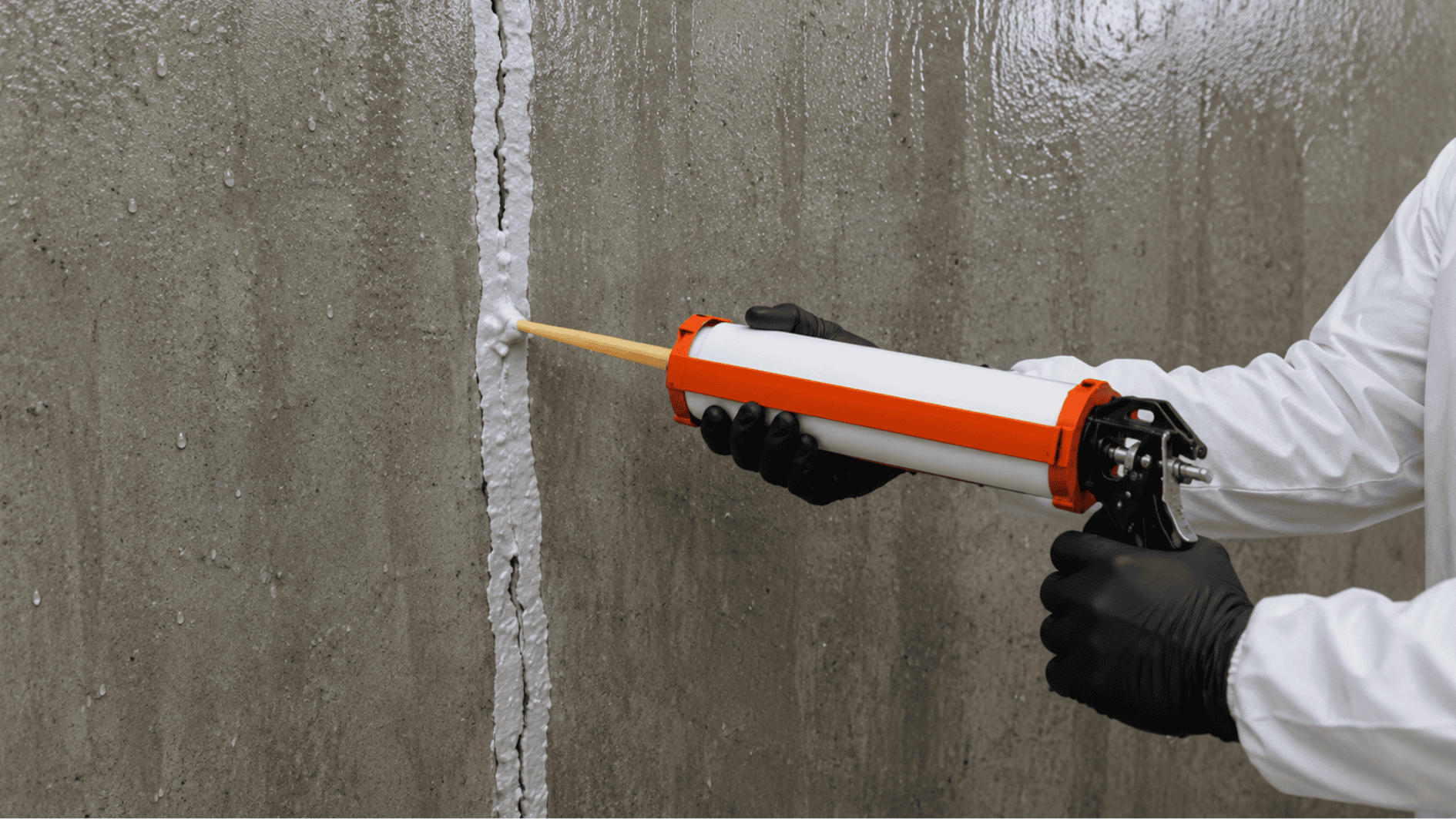 sealing a concrete crack with caulk