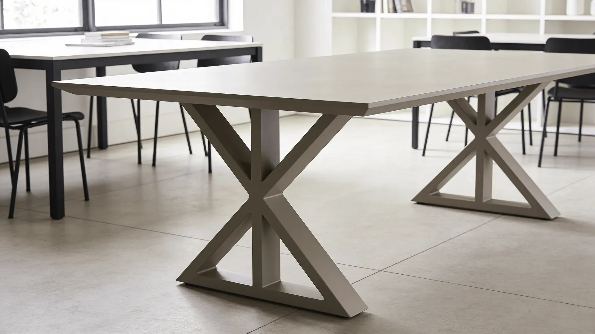 Trestle table with base frame supports instead of corner legs in a dining setup