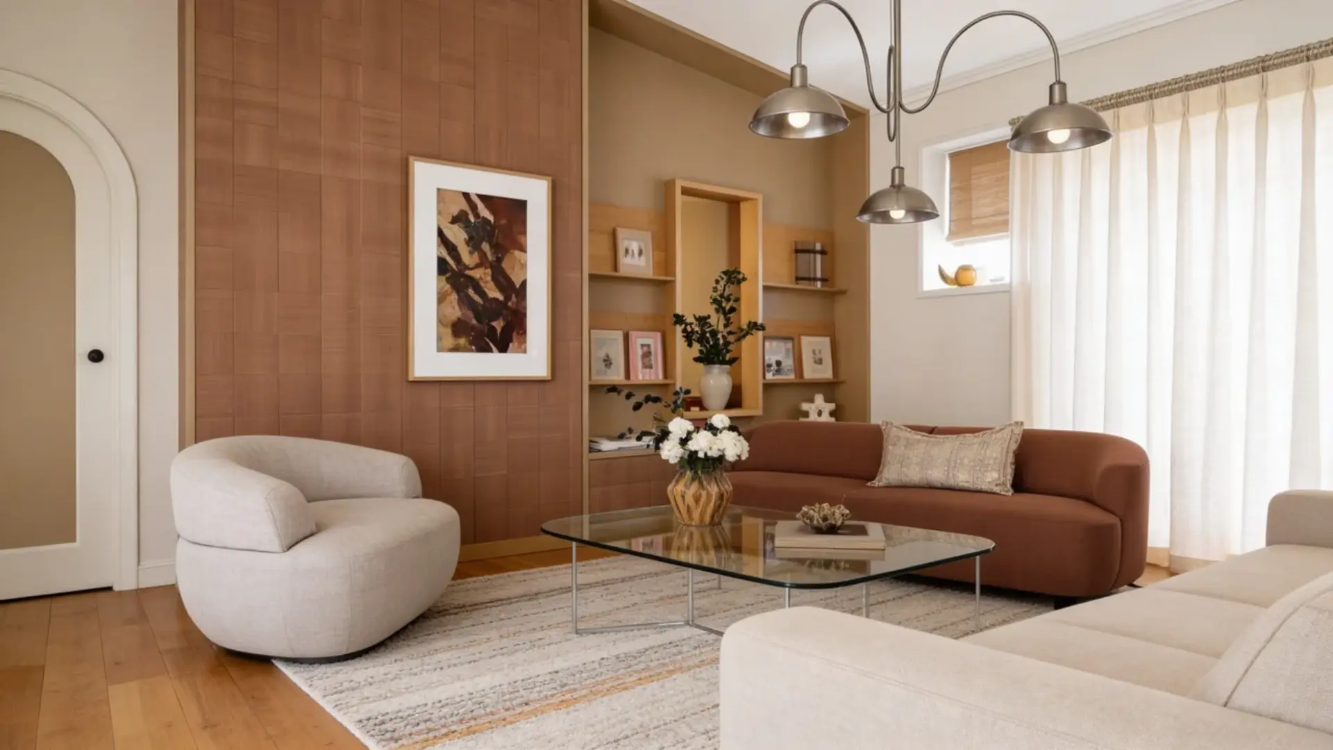 Cozy living room with colorful rug, warm tones, modern furniture, and indoor plant