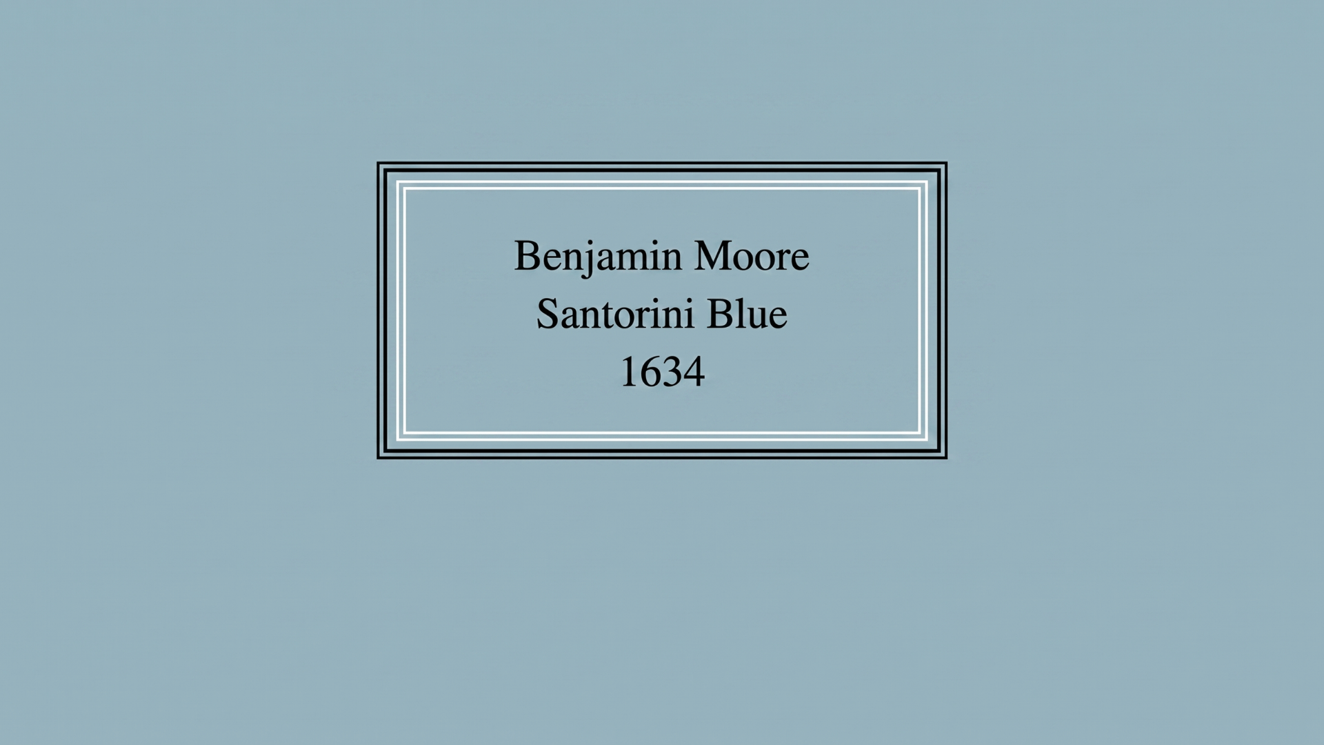 benjamin-moore-santorini-blue-1634-paint-swatch-with-a-soft-muted-blue-gray-background-and-simple-framed-label-design