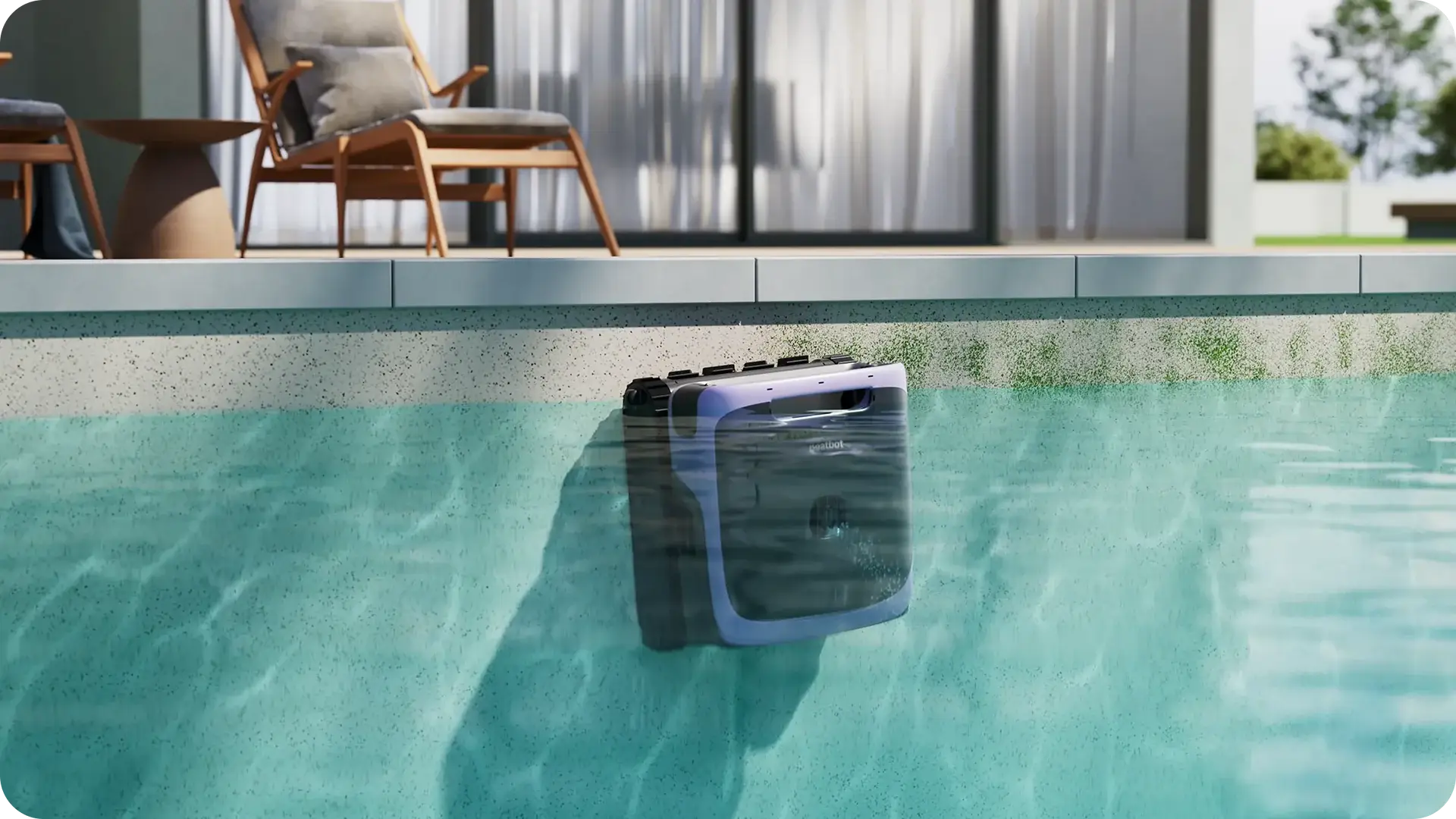 Robotic pool cleaner submerged in clear water beside patio with wooden chairs