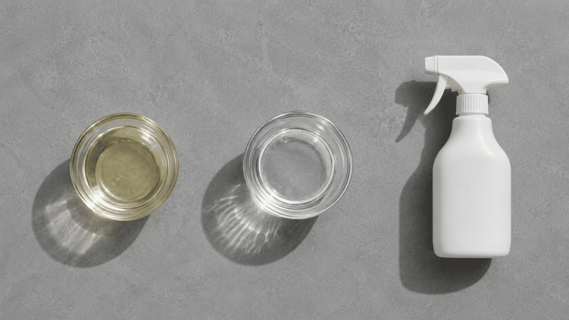 cleaning shower tiles with white vinegar water and spray bottle