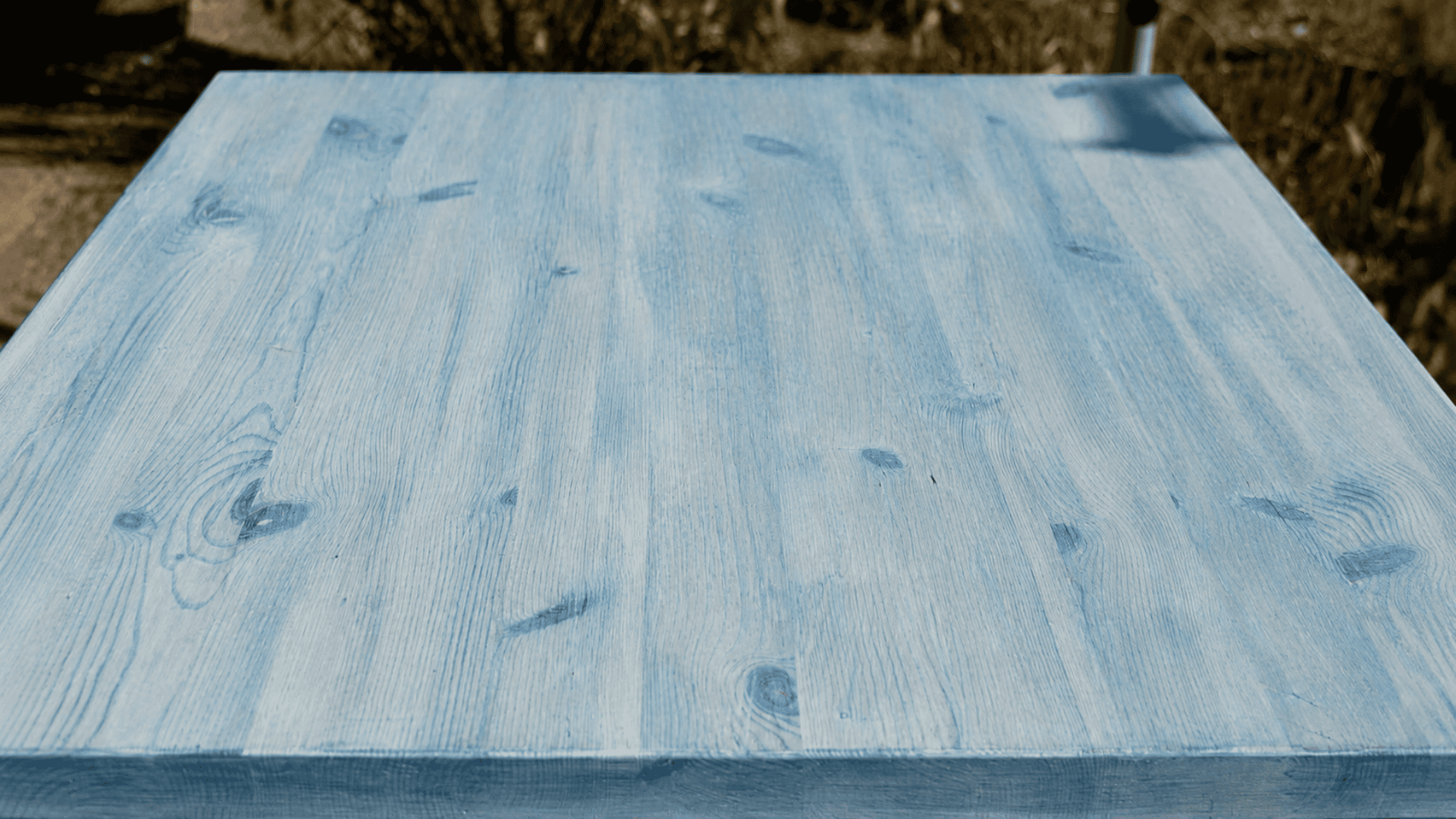 color wash technique on wood showing a translucent acrylic finish with visible wood grain