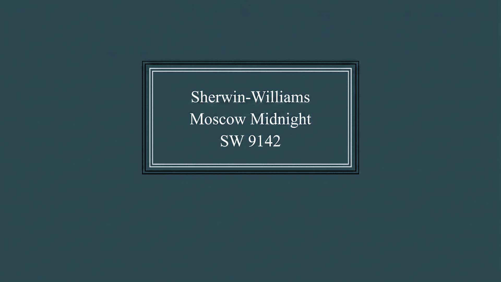 Dark blue-gray paint background with the text “Sherwin-Williams Moscow Midnight SW 9142” inside a simple framed label design.