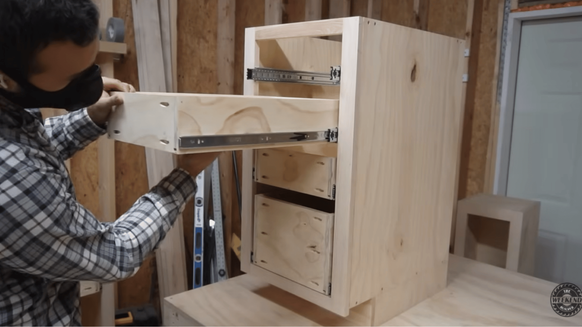 installing a plywood drawer box with soft-close drawer slides inside a custom diy kitchen cabinet frame.
