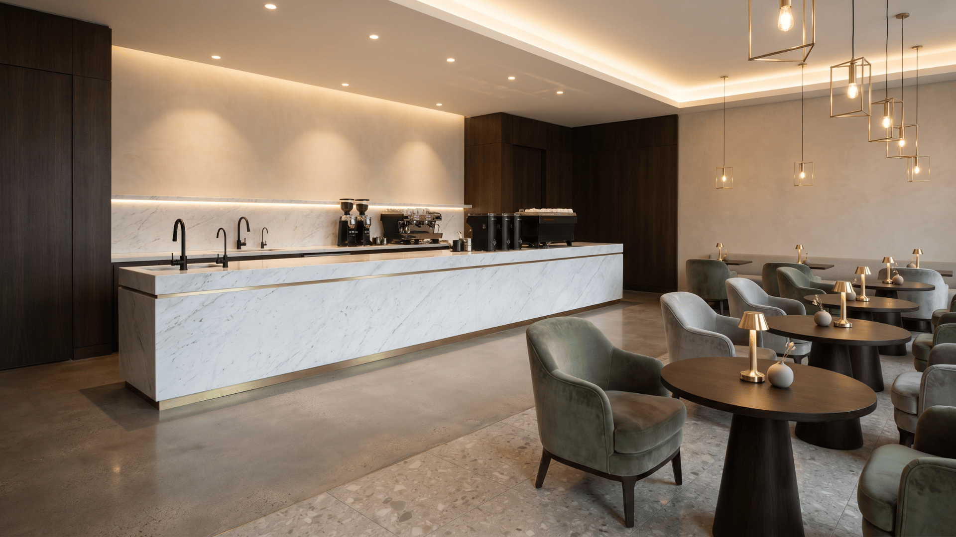 Modern luxury cafe with marble counter and brass details