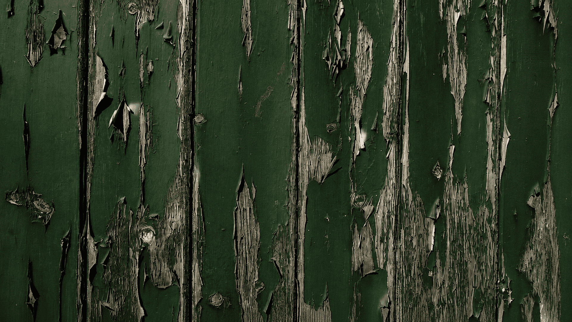 peeling acrylic paint on a wooden surface