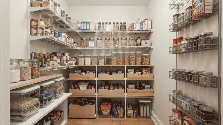 small-pantry-with-adjustable-shelves-bins-pull-out-drawers-and-clear-containers-arranged-neatly