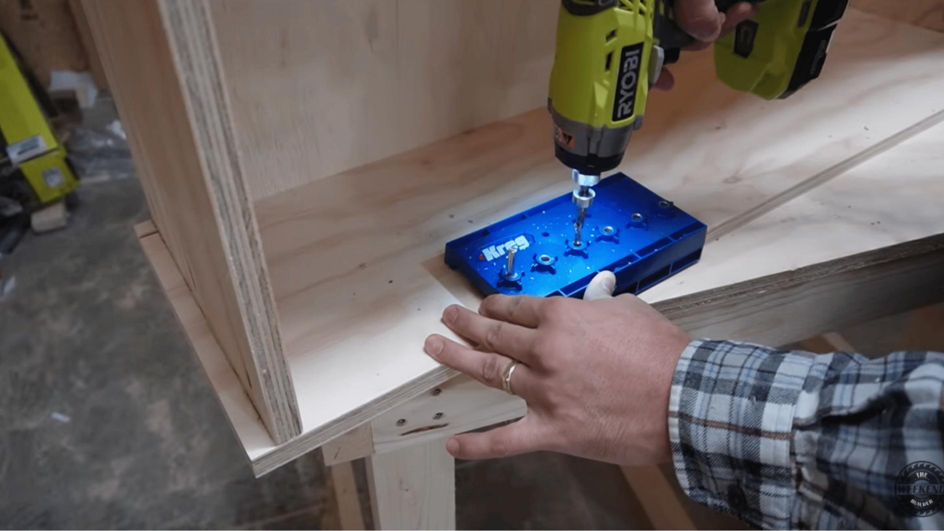 using a pocket hole jig and drill to create strong joints while assembling a plywood DIY kitchen cabinet box.