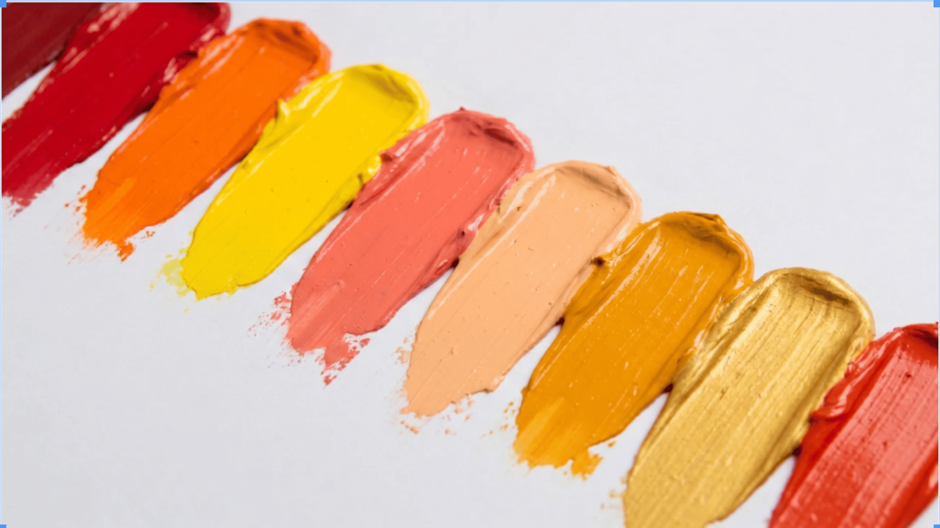 Warm paint strokes in red, orange, yellow, peach, and gold on a white background