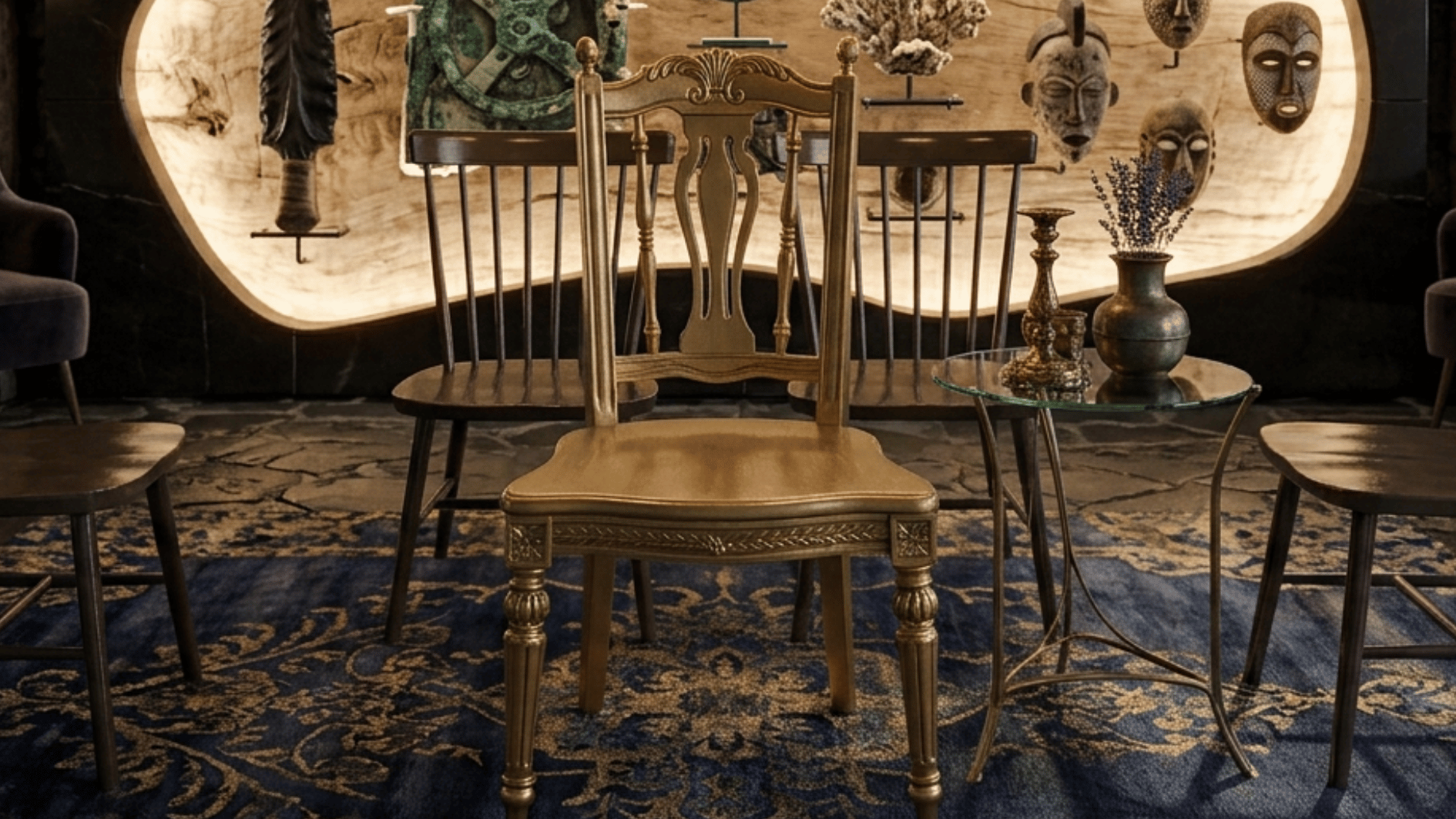 a finished wooden chair with carved spindle legs fully spray painted gold in a living room (1)