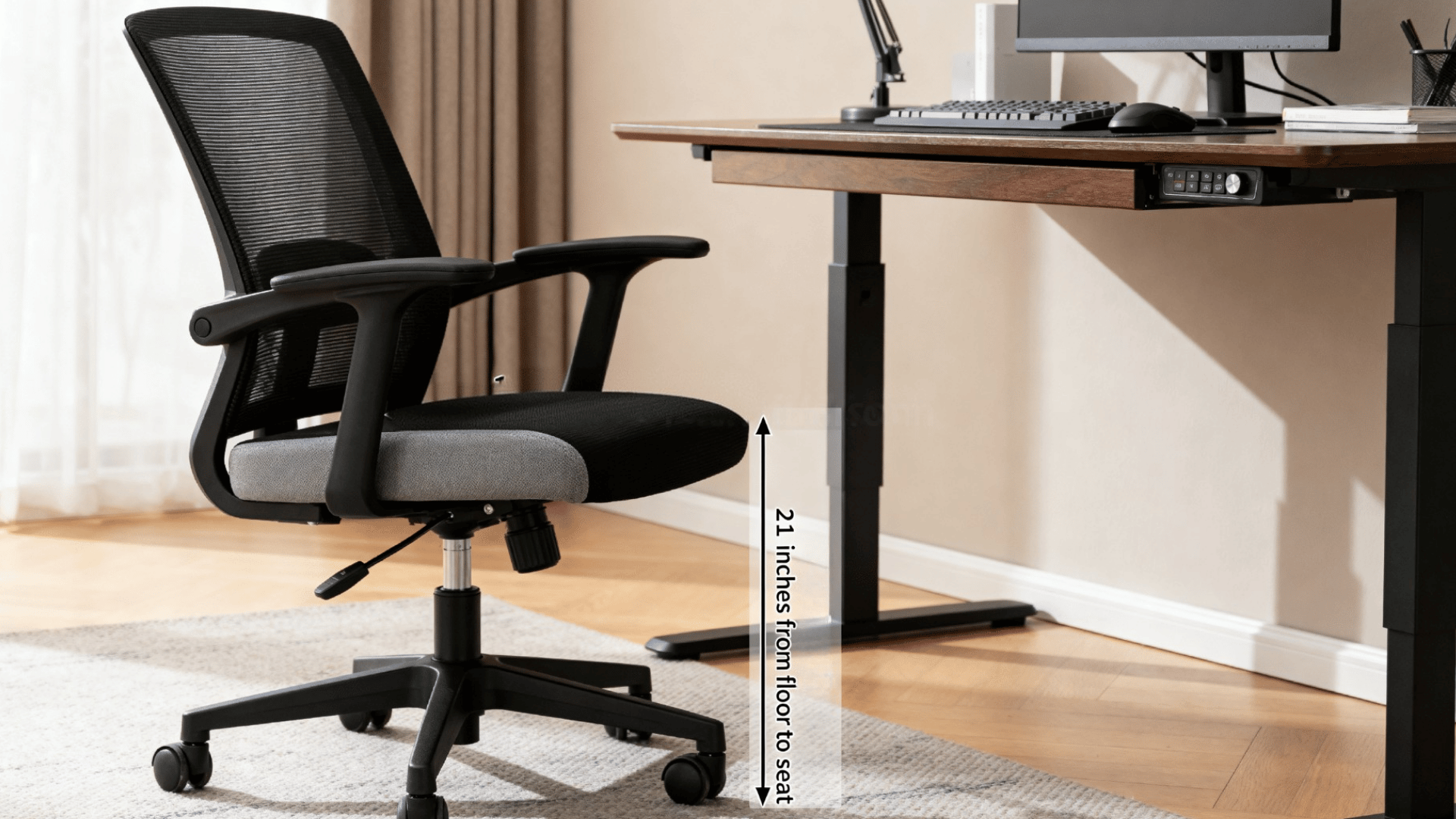 black office chair with adjustable height marker showing seat range and desk setup in realistic modern workspace
