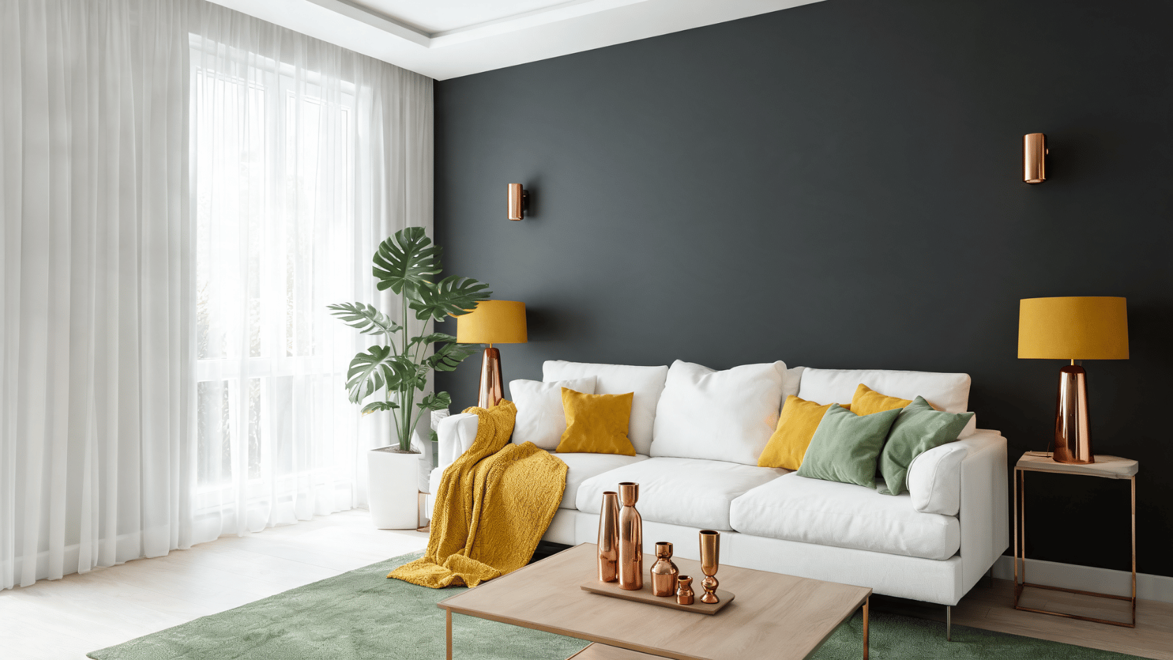 Graphite gray wall with white sofa, mustard yellow accents, sage green pillows, and copper decor.