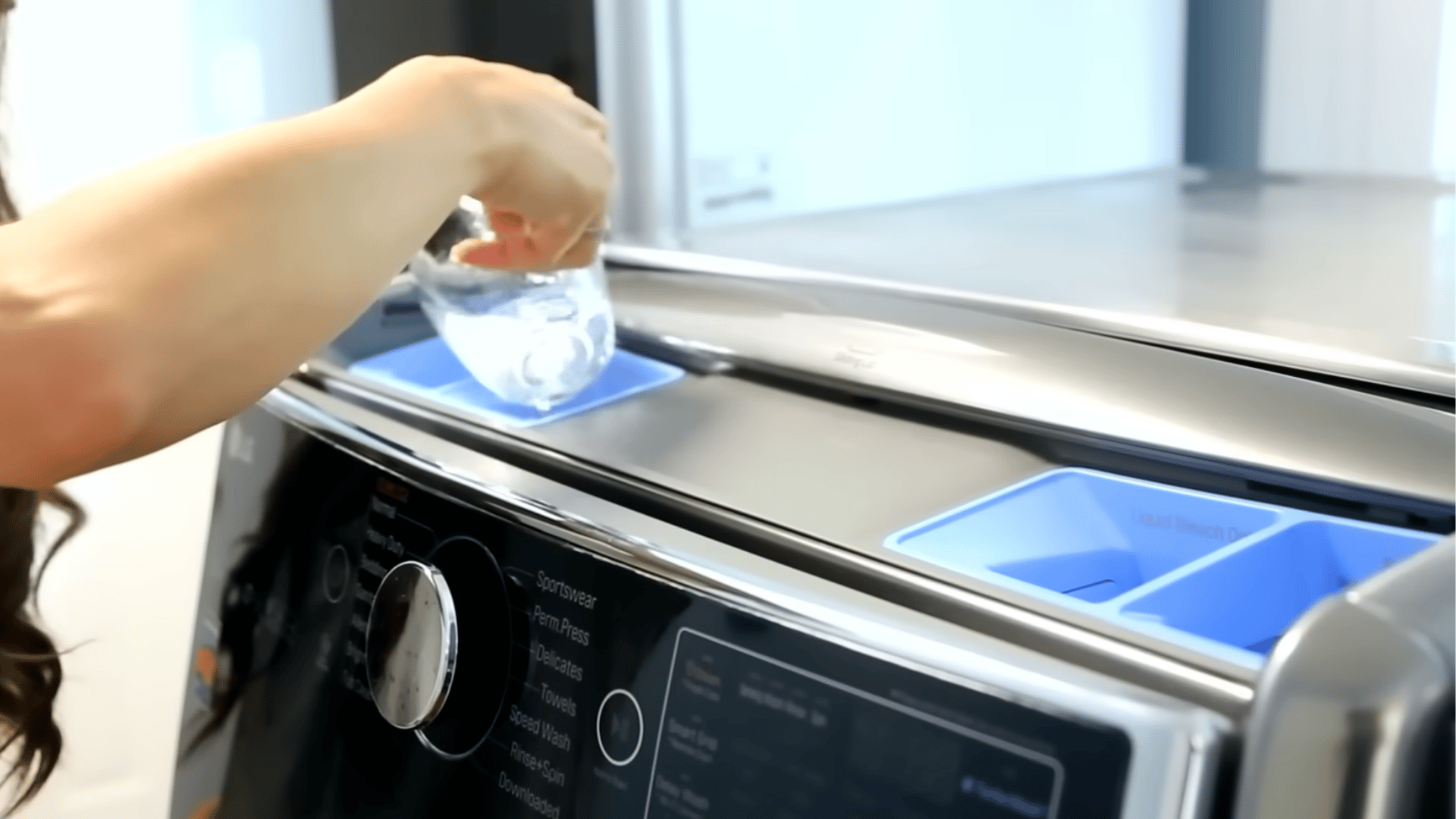 Pouring diy cleaner into the detergent dispenser tray of a washing machine