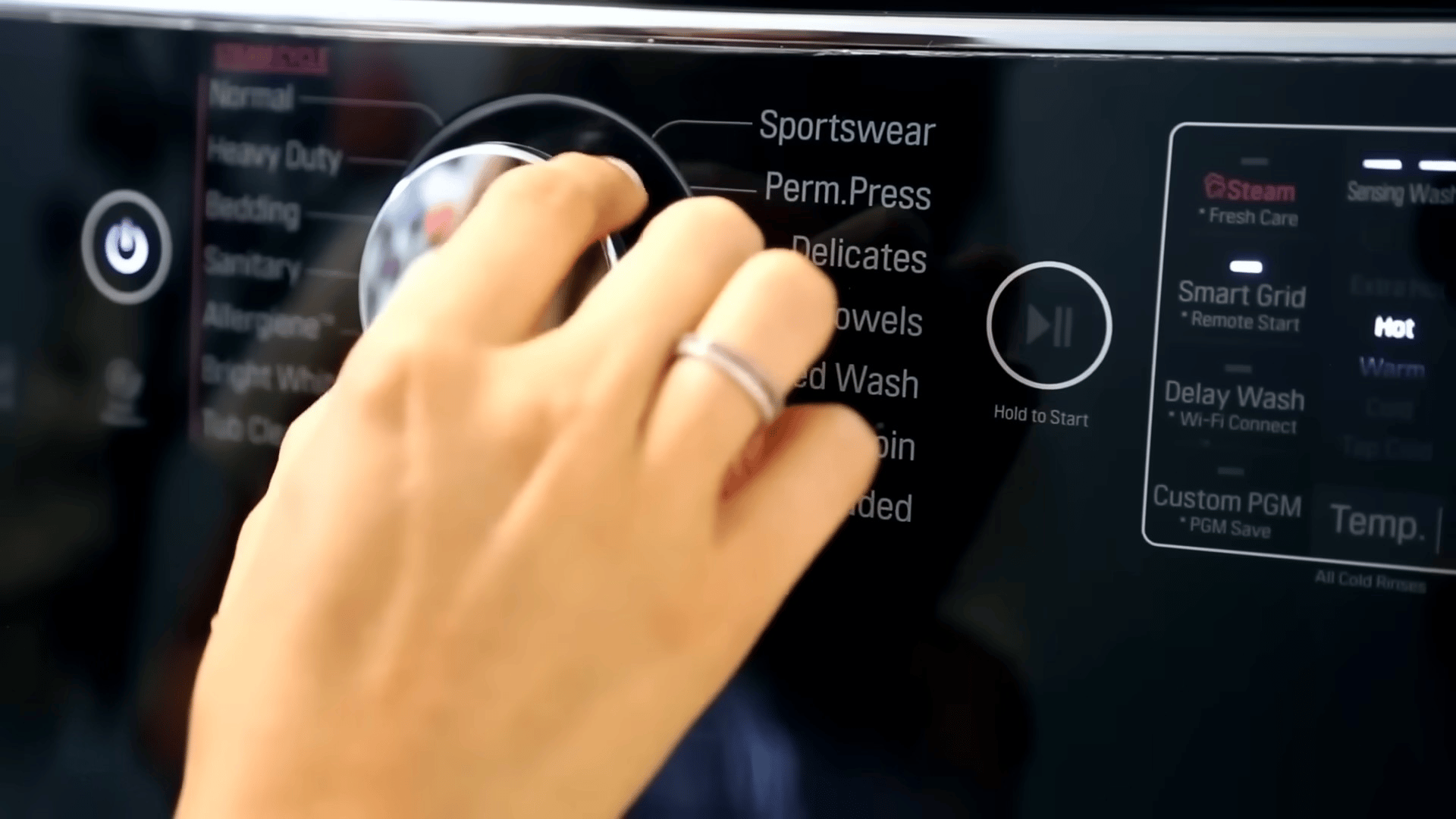 Setting the control dial on a washing machine to run a clean cycle