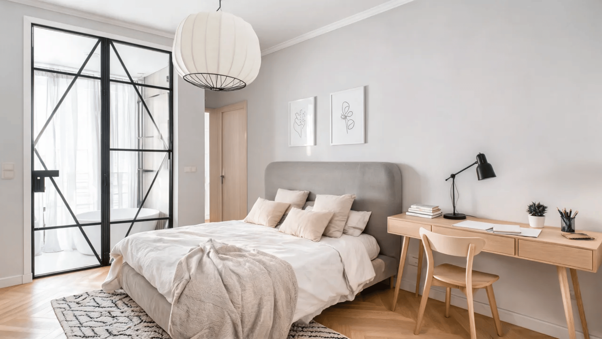 Scandinavian dorm room with light wood furniture, soft neutral textiles, and simple functional decor