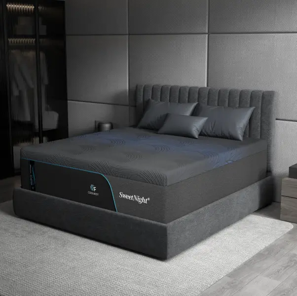Dark gray upholstered bed with quilted mattress in modern bedroom setting