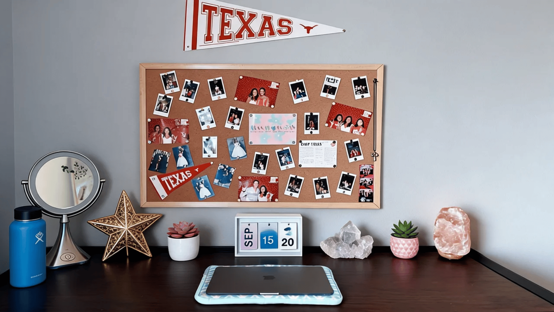 Fabric-wrapped dorm corkboard with photos, notes, tickets, and a decorative washi tape border.