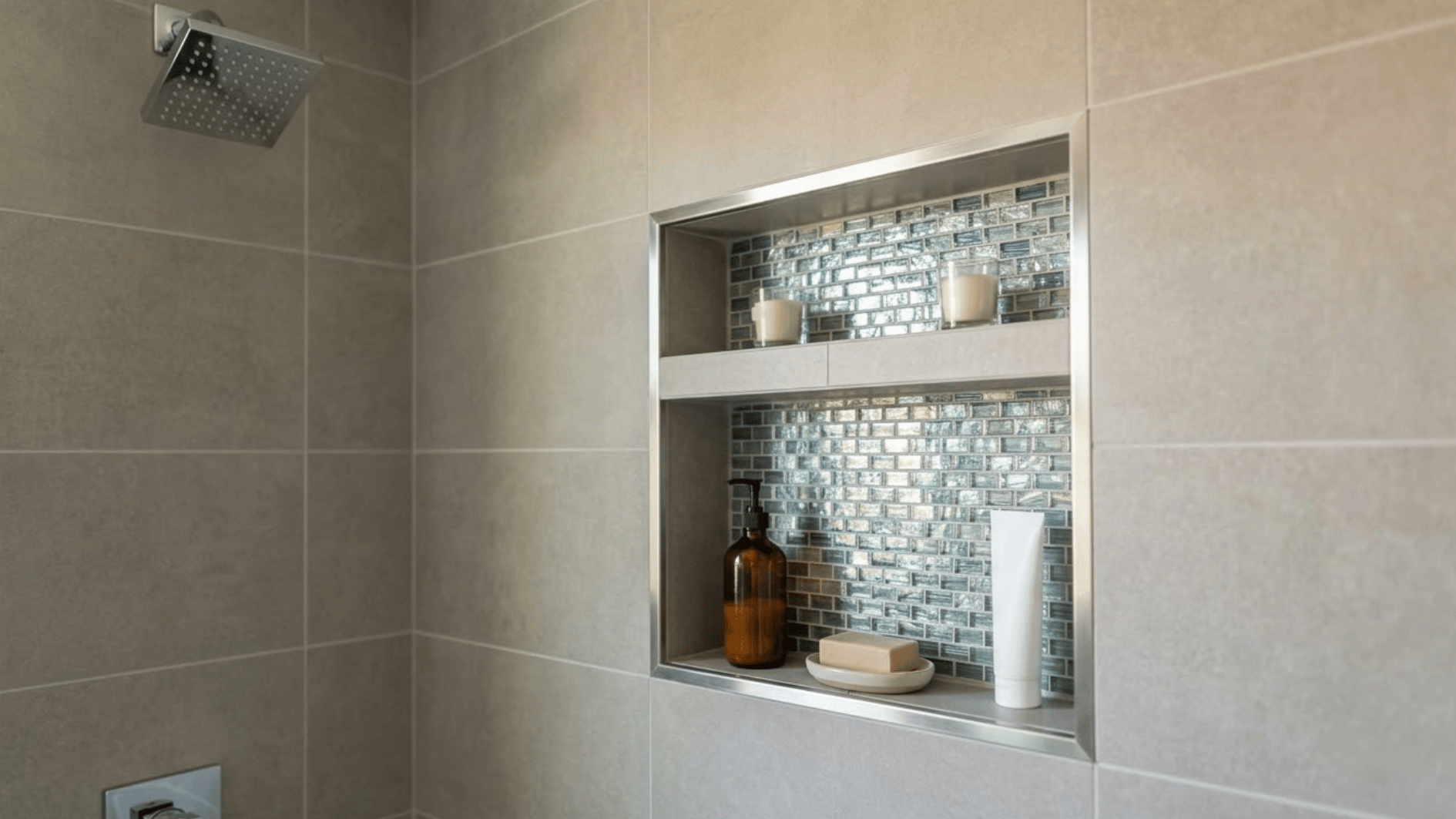 glass mosaic tile shower niche with toiletries and candles inside a modern tiled shower wall (1)