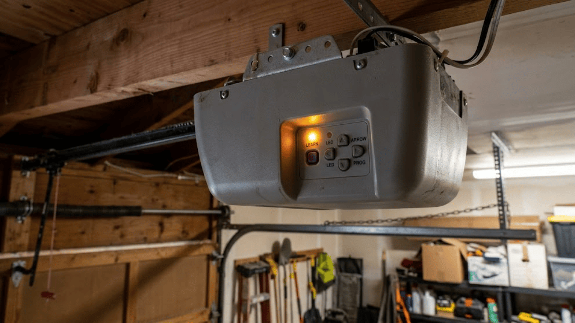 How to program a garage door opener by activating the Learn button and LED indicator on the motor unit