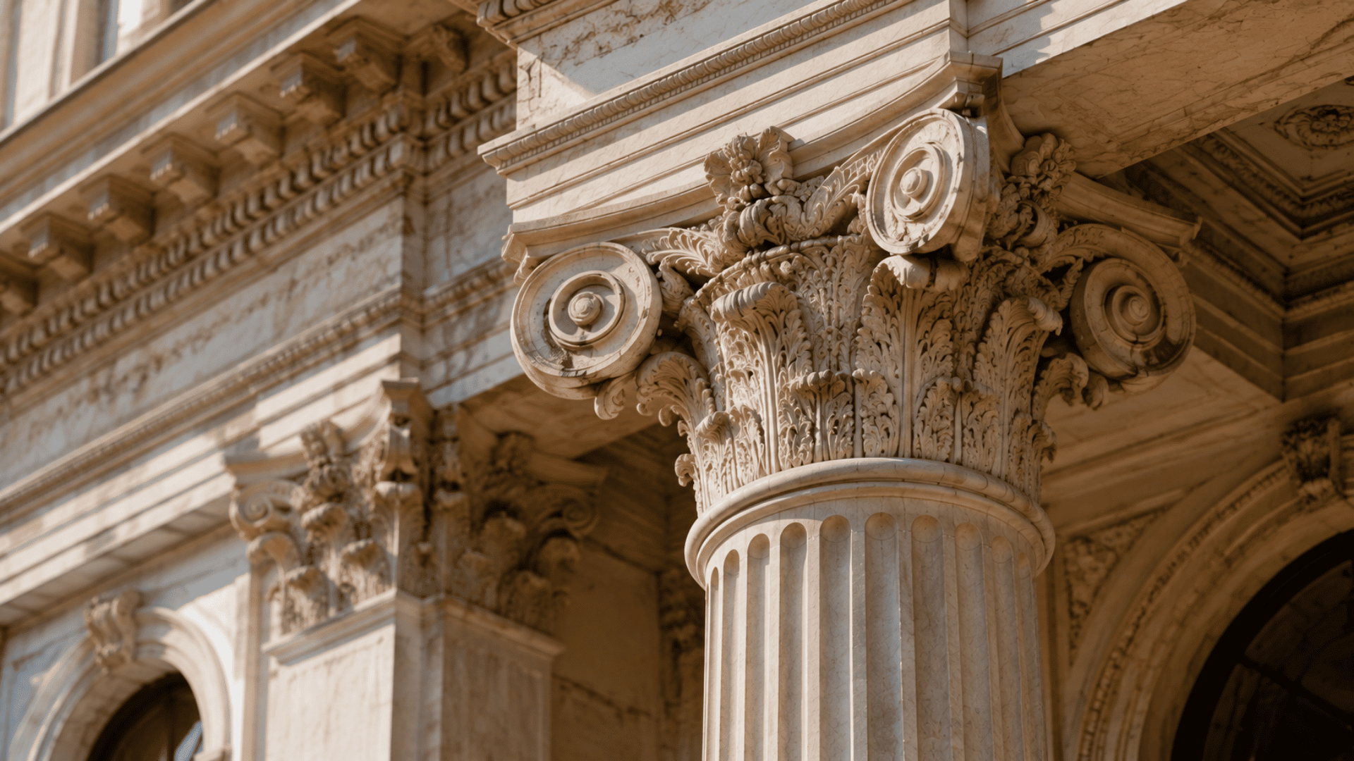 Ornate Composite column combining Ionic scrolls and Corinthian leaf details in a classical building