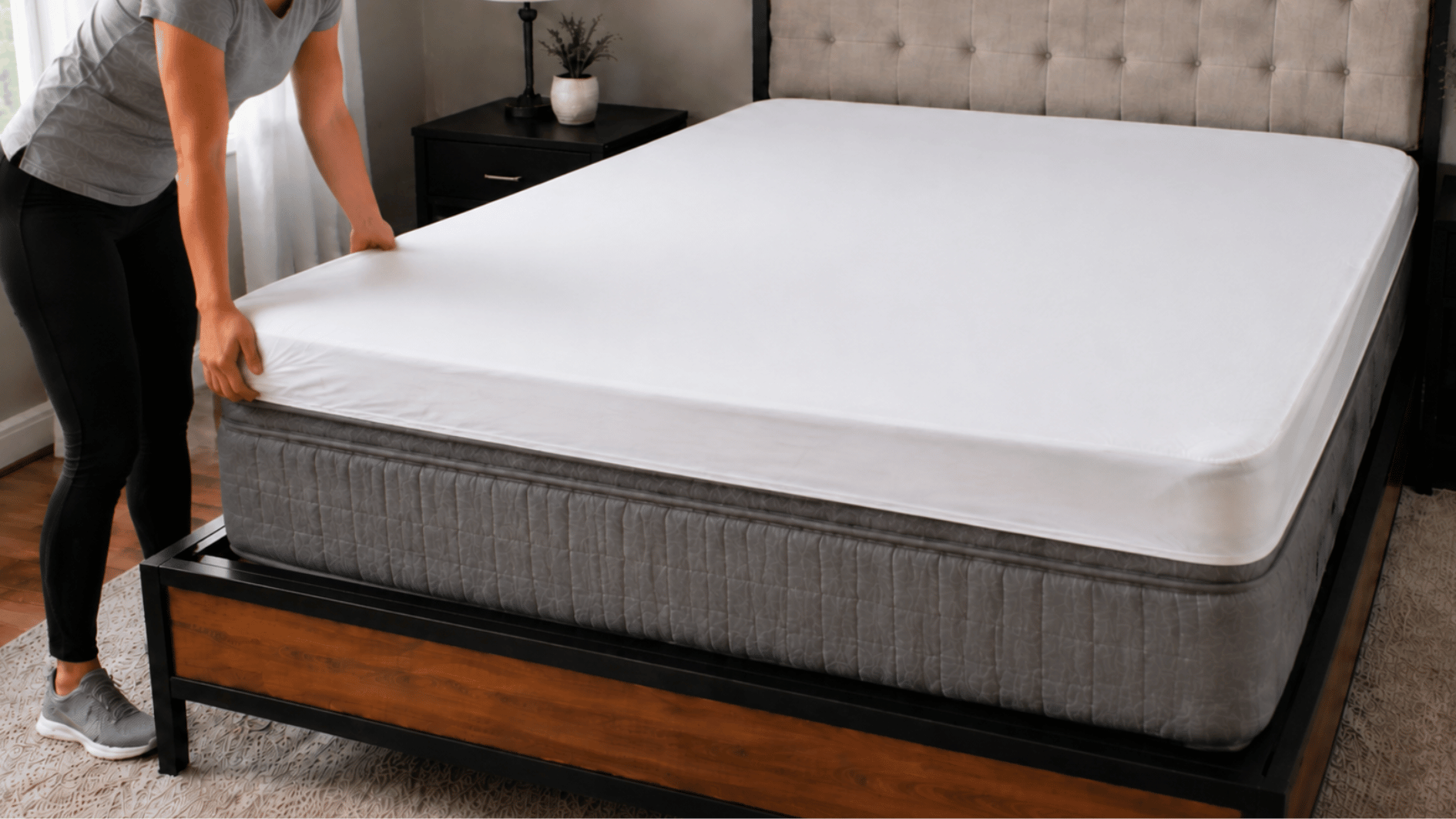 person placing a mattress protector over a freshly cleaned mattress