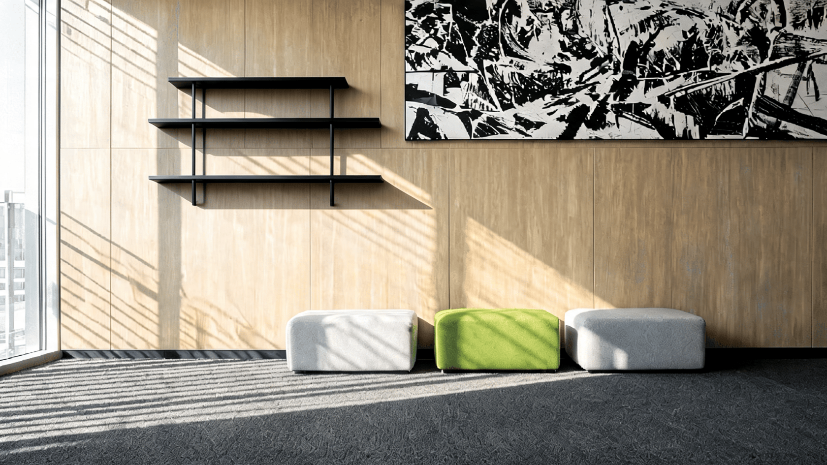 Modern living room with wood wall panels, black shelves, and low white and green seating.