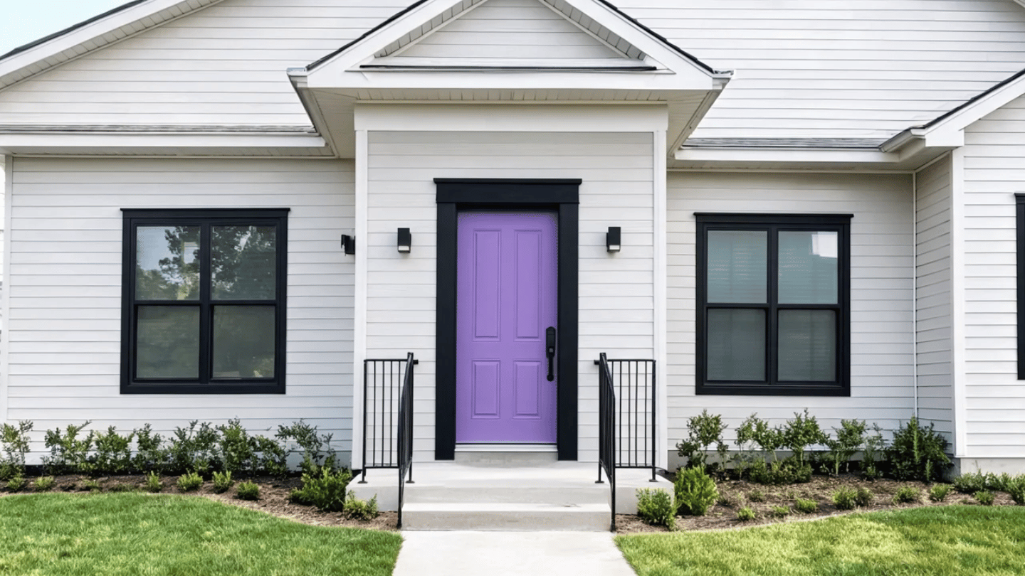 Purple front door with black trim creating a modern exterior look