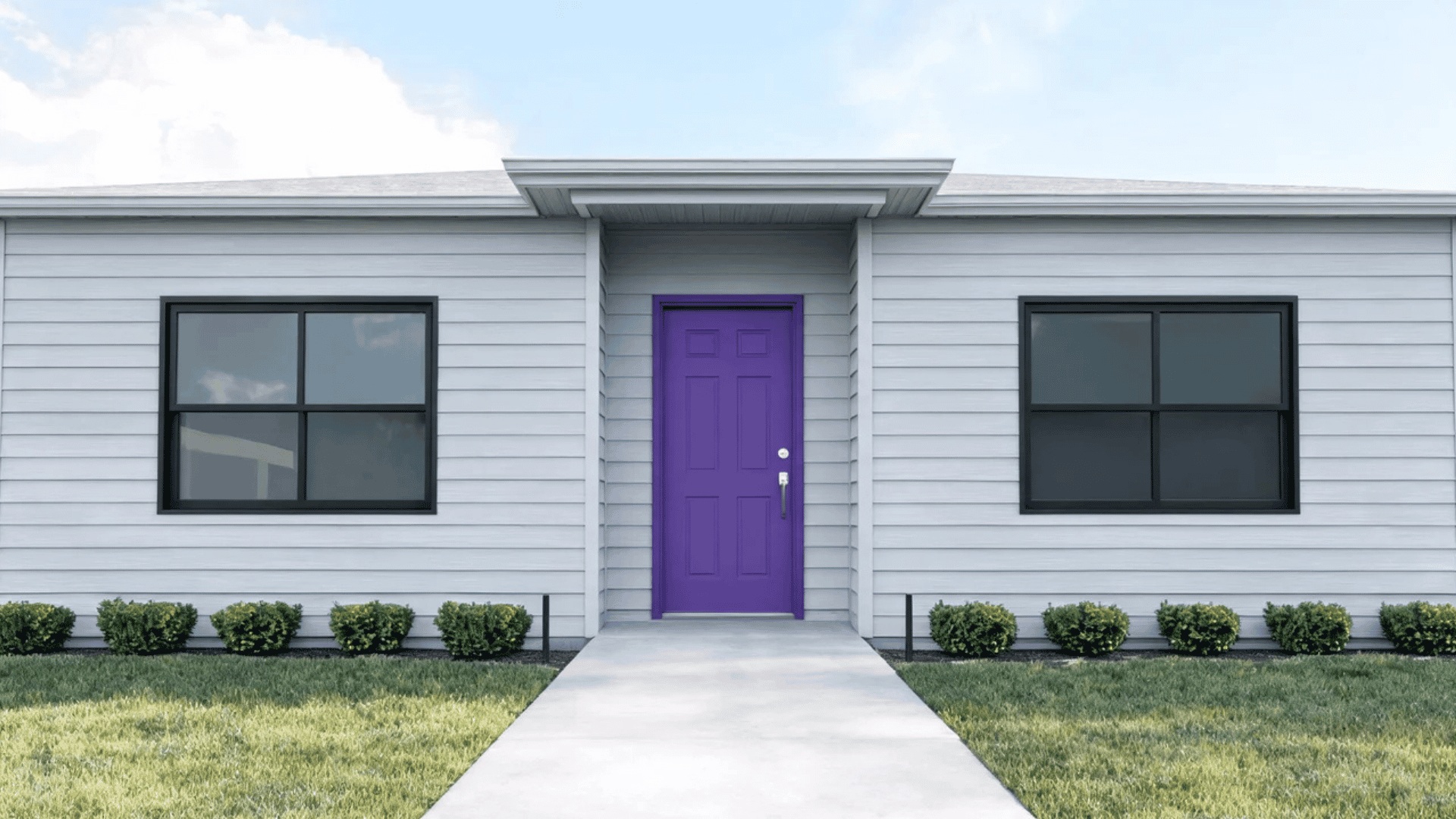 Purple front door with gray siding, silver handle, and modern exterior design creating a stylish home entrance.