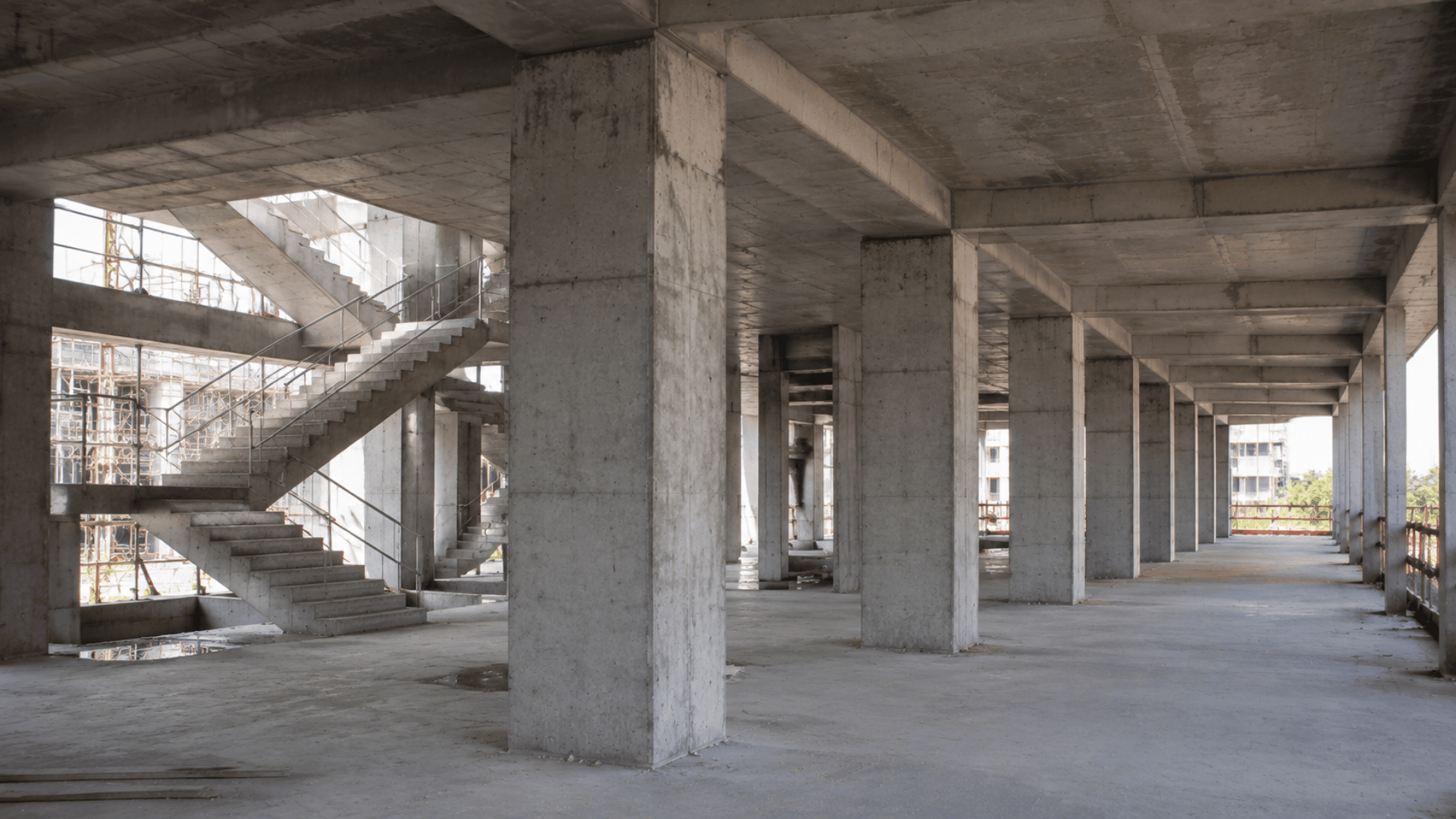 Reinforced concrete columns supporting slabs in a modern building construction site