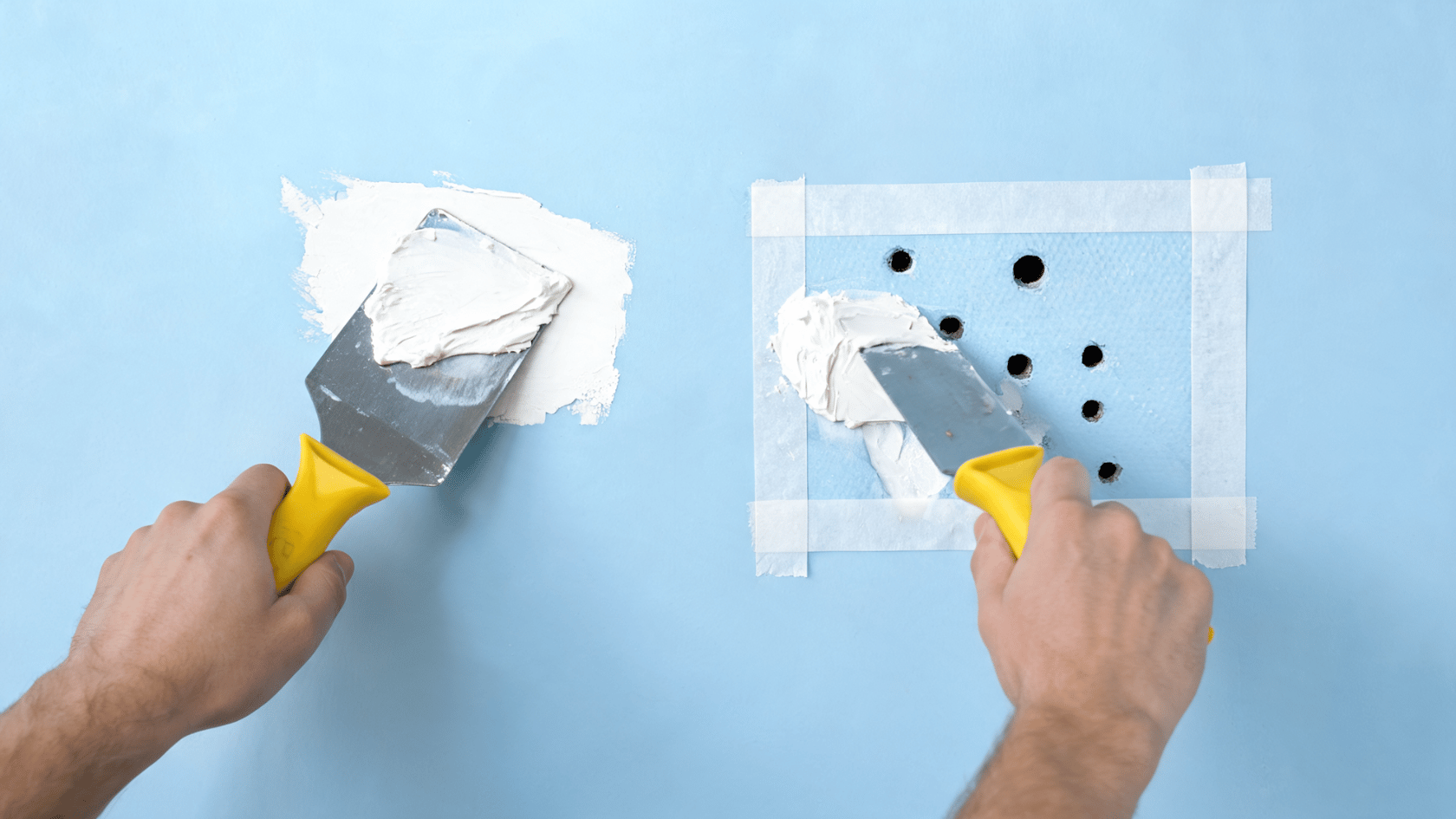 Hands applying drywall compound to fill anchor holes on a blue wall using a putty knife while following how to repair drywall anchor holes step by step.