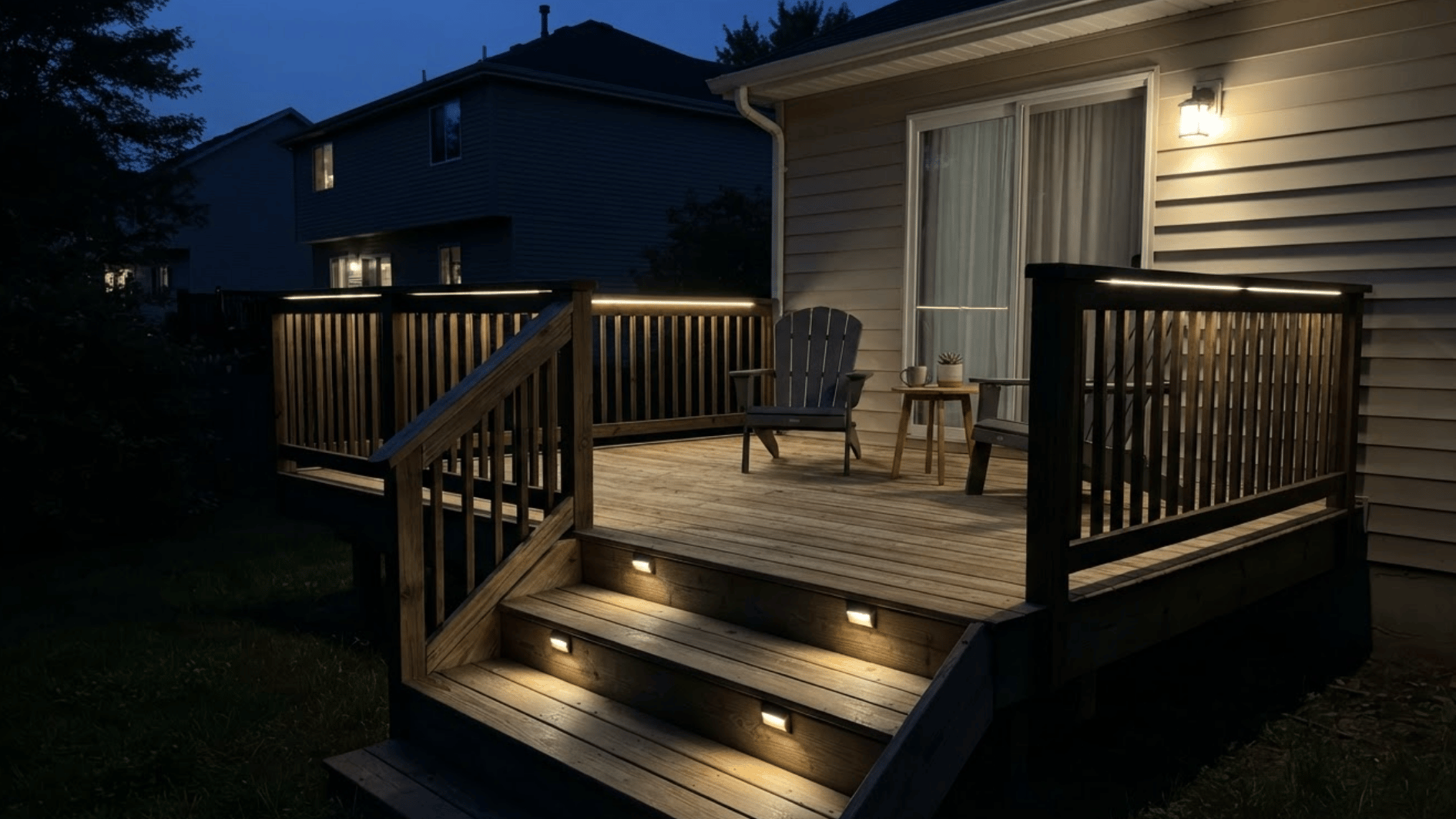 small wooden deck with minimal evenly spaced lighting fixtures at night