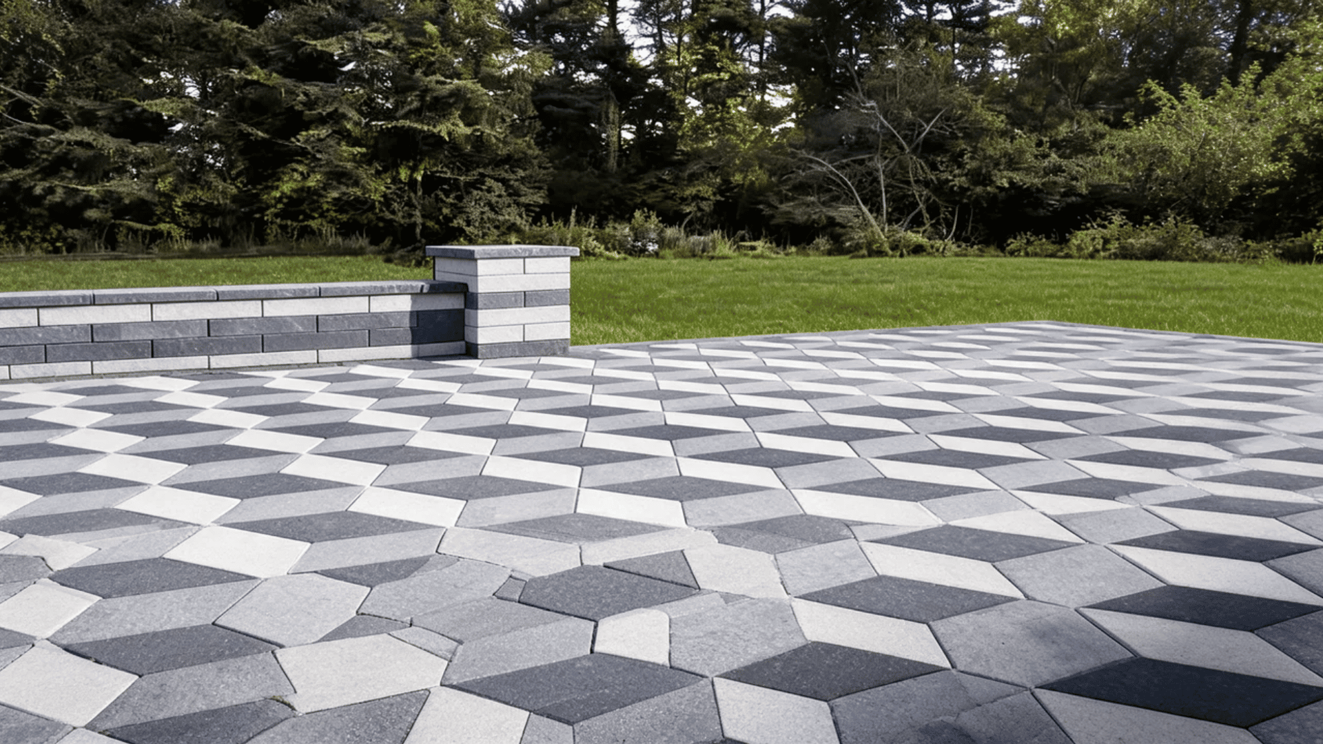 Square and rectangular stone pavers arranged in a geometric walkway pattern with garden borders.