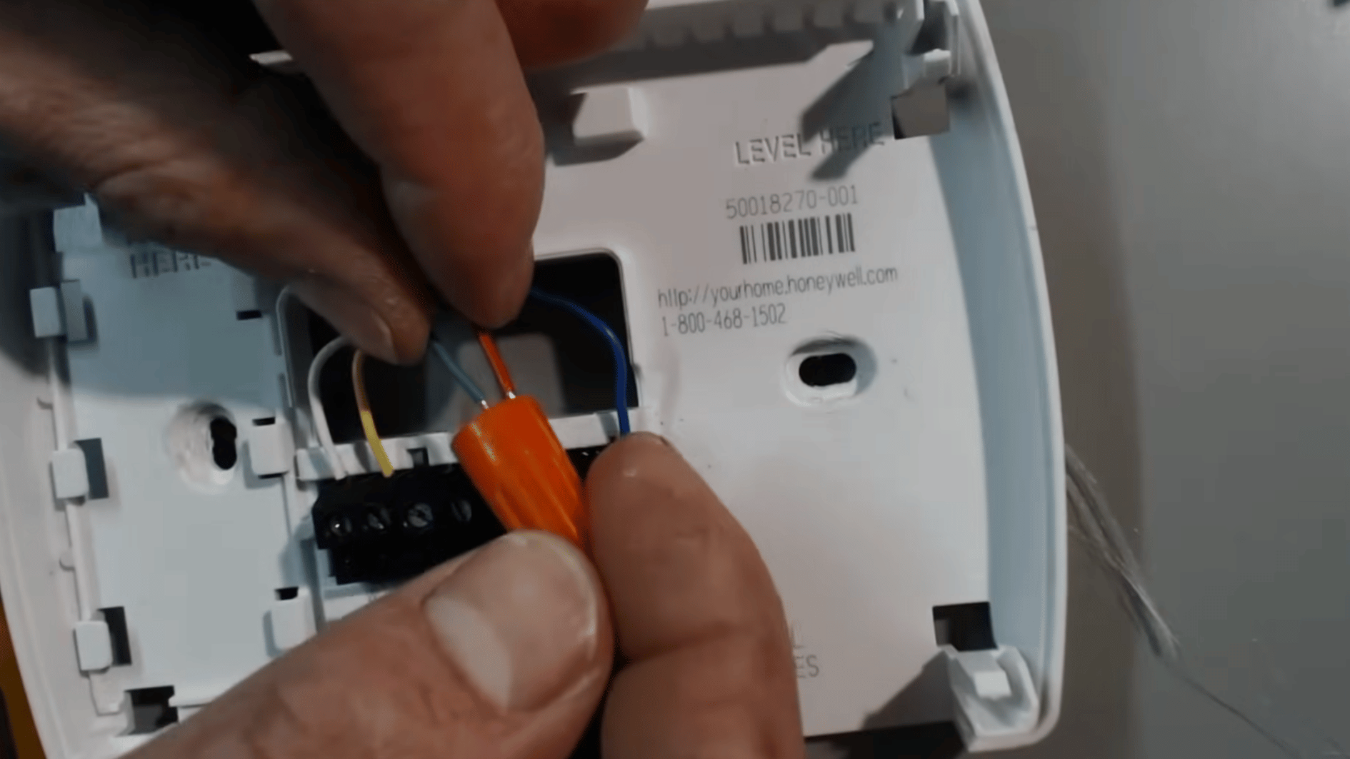 red and green thermostat wires joined with a wire nut to bypass the thermostat and test the blower fan
